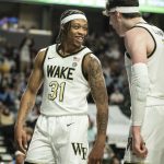 
              Wake Forest guard Alondes Williams (31) and forward Jake Laravia (0) celebrate during the first half of an NCAA college basketball game against North Carolina on Saturday, Jan. 22, 2022, in Winston-Salem, N.C. (Allison Lee Isley/The Winston-Salem Journal via AP)
            