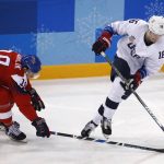 
              FILE - Ryan Donato (16), of the United States, skates with the puck past Dominik Kubalik (18), of the Czech Republic, during the second period of the quarterfinal round of the men's hockey game at the 2018 Winter Olympics in Gangneung, South Korea, Wednesday, Feb. 21, 2018. USA Hockey and Hockey Canada are eyeing several college players to play at the Olympics after the NHL decided not to participate in Beijing. Anaheim’s Troy Terry, Minnesota’s Jordan Greenway and Seattle’s Ryan Donato played for the U.S. in Pyeongchang. They are major proponents of college players taking the chance, even if it means missing part of the NCAA season. (AP Photo/Jae C. Hong, File)
            