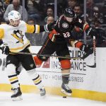 
              Pittsburgh Penguins center Teddy Blueger (53) checks Anaheim Ducks defenseman Kevin Shattenkirk (22) in the first period of an NHL hockey game in Anaheim, Calif., Tuesday, Jan. 11, 2022. (AP Photo/Kyusung Gong)
            