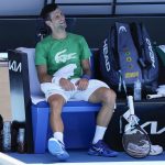 
              Defending men's champion Serbia's Novak Djokovic smiles during a break in his practice on Margaret Court Arena ahead of the Australian Open tennis championship in Melbourne, Australia, Thursday, Jan. 13, 2022. AP Photo/Mark Baker)
            