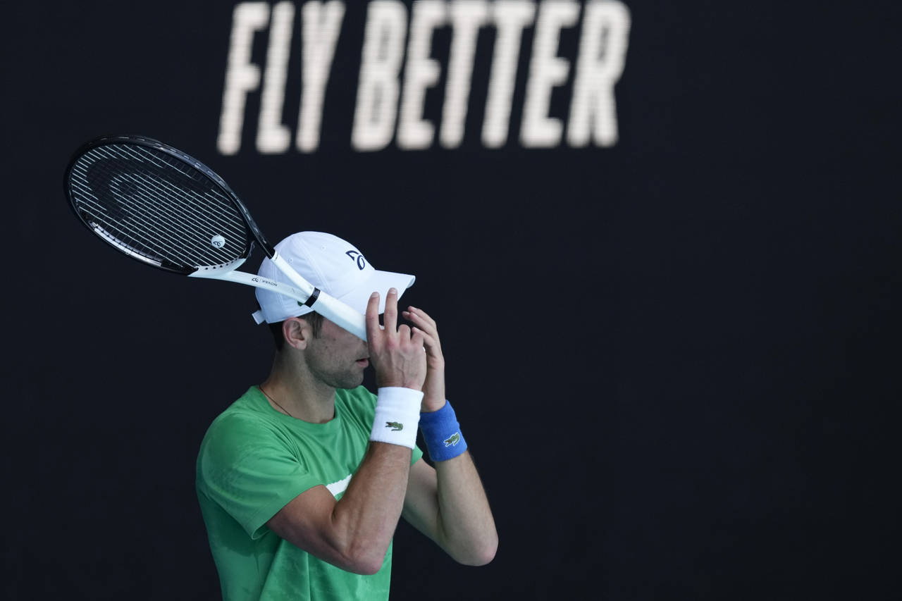 Defending men's champion Serbia's Novak Djokovic practices on Margaret Court Arena ahead of the Aus...