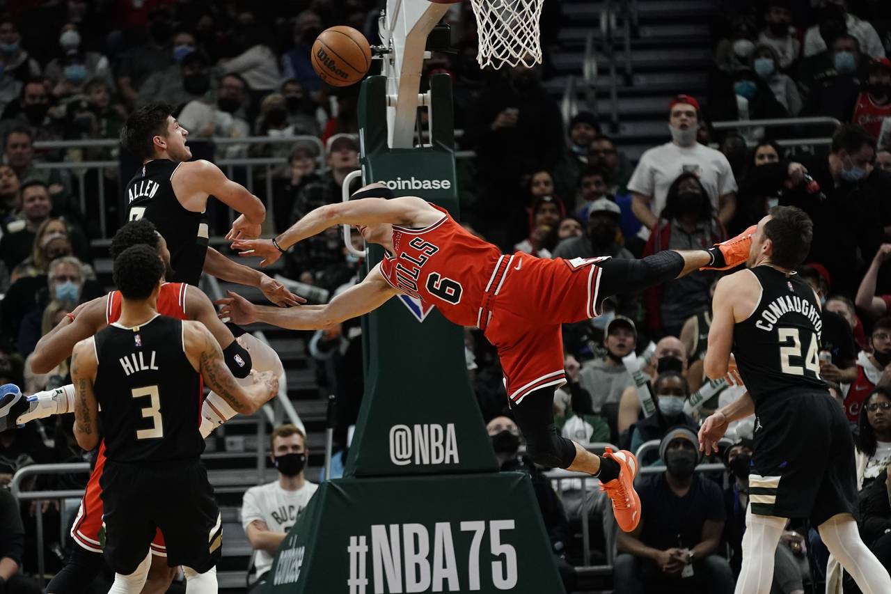 Milwaukee Bucks' Grayson Allen fouls Chicago Bulls' Alex Caruso during the second half of an NBA ba...