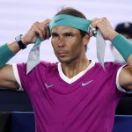 
              Rafael Nadal of Spain changes his headband during a break in his semifinal against Matteo Berrettini of Italy at the Australian Open tennis championships in Melbourne, Australia, Friday, Jan. 28, 2022. (AP Photo/Hamish Blair)
            