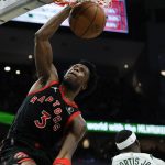 
              Toronto Raptors' OG Anunoby dunks during the first half of an NBA basketball game against the Milwaukee Bucks Saturday, Jan. 15, 2022, in Milwaukee. (AP Photo/Morry Gash)
            