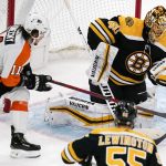 
              Boston Bruins goaltender Tuukka Rask (40) gloves the puck for a save as Philadelphia Flyers right wing Travis Konecny (11) waits for a rebound during the first period of an NHL hockey game, Thursday, Jan. 13, 2022, in Boston. (AP Photo/Charles Krupa)
            