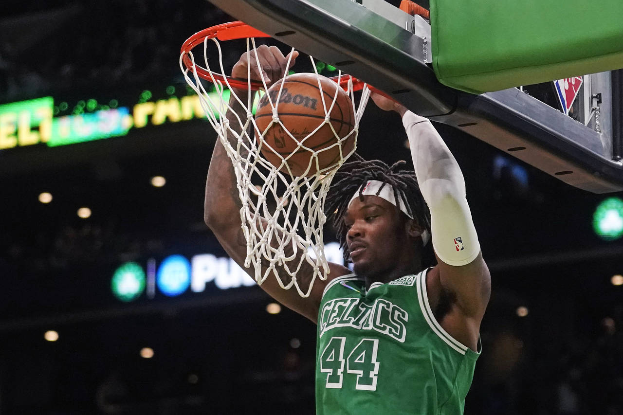 Boston Celtics center Robert Williams III (44) slams a dunk agains the Miami Heat during the first ...