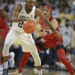 
              Rutgers Caleb McConnell (22) pressures Penn State's Jalen Pickett (22) in the first half of an NCAA college basketball game Tuesday, Jan 11, 2022, in State College, Pa. (AP Photo/Gary M. Baranec)
            