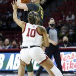 
              Baylor forward Caitlin Bickle (51) looks to a pass the ball away from Oklahoma guard Kelbie Washington (10) during the first half of an NCAA college basketball game Wednesday, Jan. 12, 2022, in Norman, Okla. (AP Photo/Garett Fisbeck)
            