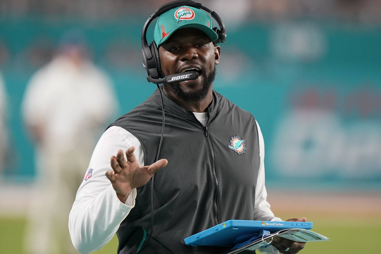 Miami Dolphins head coach Brian Flores directs his team during the second half of an NFL football g...