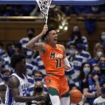 
              Miami guard Jordan Miller (11) reacts after a dunk against Duke during the second half of an NCAA college basketball game in Durham, N.C., Saturday, Jan. 8, 2022. (AP Photo/Gerry Broome)
            