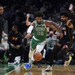 
              Miami Heat guard Gabe Vincent (2) fouls Boston Celtics guard Marcus Smart (36) during the first half of an NBA basketball game, Monday, Jan. 31, 2022, in Boston. At left is Miami Heat head coach Erik Spoelstra. (AP Photo/Charles Krupa)
            