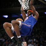 
              New York Knicks center Mitchell Robinson (23) dunks against the Dallas Mavericks during the second half of an NBA basketball game, Wednesday, Jan. 12, 2022 in New York. (AP Photo/Noah K. Murray)
            