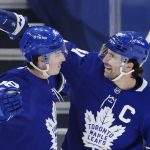 
              Toronto Maple Leafs' Mitchell Marner (16) celebrates his goal with teammate John Tavares (91) after scoring a goal against the Anaheim Ducks during the first period of an NHL hockey game in Toronto on Wednesday, Jan 26, 2022. (Frank Gunn/The Canadian Press via AP)
            