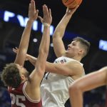 
              Penn State's John Harrar (21) shoots over Indiana's Race Thompson (25) during an NCAA college basketball game Sunday Jan 2, 2022, in State College, Pa. (AP Photo/Gary M. Baranec)
            