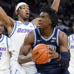 
              Villanova forward Brandon Slater, second from right, drives to the basket against DePaul forward Javan Johnson during the first half of an NCAA college basketball game in Chicago, Saturday, Jan. 8, 2022. (AP Photo/Nam Y. Huh)
            
