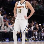 
              Denver Nuggets center Nikola Jokic (15) stands on the court during the fourth quarter of an NBA basketball game against the Dallas Mavericks in Dallas, Monday, Jan. 3, 2022. (AP Photo/LM Otero)
            