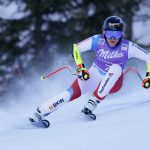 
              Switzerland's Lara Gut Behrami speeds down the course during an alpine ski, women's World Cup super-G race in Zauchensee, Austria, Sunday, Jan. 16, 2022. (AP Photo/Giovanni Maria Pizzato)
            
