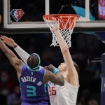 
              Charlotte Hornets guard Terry Rozier (3) attempts a shot over Los Angeles Clippers center Isaiah Hartenstein (55) during the first half of an NBA basketball game Sunday, Jan. 30, 2022, in Charlotte, N.C. (AP Photo/Rusty Jones)
            