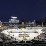 
              Fans in the stands wait for the Winter Classic NHL hockey game between St. Louis Blues and the Minnesota Wild on Saturday, Jan. 1, 2022, in Minneapolis. (AP Photo/Andy Clayton-King)
            