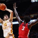 
              Tennessee forward John Fulkerson (10) shoots over Mississippi center Nysier Brooks (3) during the first half of an NCAA college basketball game Wednesday, Jan. 5, 2022, in Knoxville, Tenn. (AP Photo/Wade Payne)
            