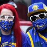 
              Fans wait for an NBA basketball game between the Golden State Warriors and the Chicago Bulls in Chicago, Friday, Jan. 14, 2022. (AP Photo/Nam Y. Huh)
            