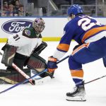 
              New York Islanders left wing Anders Lee (27) pressures Arizona Coyotes goaltender Scott Wedgewood (31) during the second period of an NHL hockey game Friday, Jan. 21, 2022, in Elmont, N.Y. (AP Photo/Corey Sipkin).
            