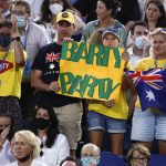 
              Supporters of Australia's Ash Barty hold up signs of support during her semifinal against Madison Keys of the U.S. at the Australian Open tennis championships in Melbourne, Australia, Thursday, Jan. 27, 2022. (AP Photo/Hamish Blair)
            