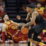 
              Missouri guard Jarron Coleman (5) drives the ball as he fouls Iowa State guard Gabe Kalscheur (22) during the first half of an NCAA college basketball game, Saturday, Jan. 29, 2022, in Ames. (AP Photo/Matthew Putney)
            