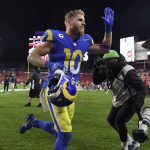 
              Los Angeles Rams wide receiver Cooper Kupp (10) celebrates as he leaves the field after the team defeated the Tampa Bay Buccaneers during an NFL divisional round playoff football game Sunday, Jan. 23, 2022, in Tampa, Fla. (AP Photo/Jason Behnken)
            
