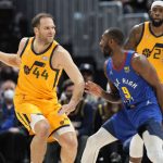 
              Utah Jazz forward Bojan Bogdanovic, left, looks to pass the ball as Denver Nuggets guard Davon Reed defends in the first half of an NBA basketball game Wednesday, Jan. 5, 2022, in Denver. (AP Photo/David Zalubowski)
            