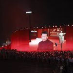 
              FILE - Chinese President Xi Jinping is displayed on a screen during the evening gala evening held on Tiananmen Square for the 70th anniversary of the founding of the People's Republic of China in Beijing on Oct. 1, 2019. As Beijing prepares to hold the Winter Olympics opening in February 2022, China's president and party leader Xi Jinping appears firmly in control. The party has made political stability paramount and says that has been the foundation for the economic growth that has bettered lives and put the nation on a path to becoming a regional if not global power. (AP Photo/Ng Han Guan, File)
            