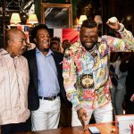 
              Former Boston Red Sox player David Ortiz, right, celebrates his election to the baseball hall of fame with his father Leo Ortiz, left, and MLB Hall of Fame player Pedro Martinez, center, at the moment of receiving the news in Santo Domingo, Dominican Republic, Tuesday, Jan. 25, 2022. (AP Photo/Manolito Jimenez)
            