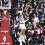 
              Purdue's Jaden Ivey (23) shoots over Indiana's Trayce Jackson-Davis (23) during the second half of an NCAA college basketball game, Thursday, Jan. 20, 2022, in Bloomington, Ind. (AP Photo/Darron Cummings)
            