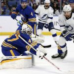 
              Buffalo Sabres goaltender Malcolm Subban (47) knocks the puck away from Tampa Bay Lightning center Anthony Cirelli (71) during the second period of an NHL hockey game Tuesday, Jan. 11, 2022, in Buffalo, N.Y. (AP Photo/Joshua Bessex)
            