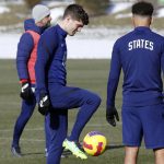 
              U.S. men's national team soccer Christian Pulisic, left, talks with midfielder Tyler Adams during practice in Columbus, Ohio, Wednesday, Jan. 26, 2022, ahead of Thursday's World Cup qualifying match against El Salvador. (AP Photo/Paul Vernon)
            