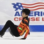 
              Nathan Chen falls in the men's free skate program during the U.S. Figure Skating Championships Sunday, Jan. 9, 2022, in Nashville, Tenn. (AP Photo/Mark Zaleski)
            