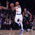 
              New York Knicks' Cam Reddish passes during the second half of an NBA basketball game against the Sacramento Kings, Monday, Jan. 31, 2022, in New York. (AP Photo/Seth Wenig)
            