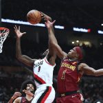 
              Cleveland Cavaliers guard Rajon Rondo attempts to block a shot by Portland Trail Blazers forward Nassir Little during the first half of an NBA basketball game in Portland, Ore., Friday, Jan. 7, 2022. (AP Photo/Amanda Loman)
            