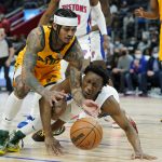 
              Utah Jazz guard Jordan Clarkson (00) and Detroit Pistons guard Saben Lee (38) chase the loose ball during the second half of an NBA basketball game, Monday, Jan. 10, 2022, in Detroit. (AP Photo/Carlos Osorio)
            