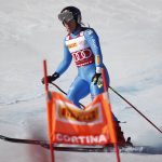 
              Italy's Sofia Goggia leaves the course of an alpine ski, women's World Cup super-G race in Cortina d'Ampezzo, Italy, Sunday, Jan. 23, 2022. (AP Photo/Gabriele Facciotti)
            