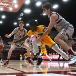
              Arizona State center Enoch Boakye, middle, reaches for the ball between Stanford forward Max Murrell, rear, and forward Maxime Raynaud during the first half of an NCAA college basketball game in Stanford, Calif., Saturday, Jan. 22, 2022. (AP Photo/Jeff Chiu)
            