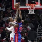 
              Chicago Bulls' DeMar DeRozan, left, shoots past Detroit Pistons' Josh Jackson during the first half of an NBA basketball game Tuesday, Jan. 11, 2022, in Chicago. (AP Photo/Charles Rex Arbogast)
            