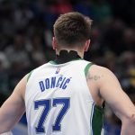 
              Dallas Mavericks guard Luka Doncic (77) wears tape over the back of his neck as he plays in the first half of an NBA basketball game against the Memphis Grizzlies in Dallas, Sunday, Jan. 23, 2022. (AP Photo/Tony Gutierrez)
            