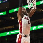 
              Miami Heat center Bam Adebayo (13) scores during the second half of an NBA basketball game against the Atlanta Hawks, Friday, Jan. 21, 2022, in Atlanta. (AP Photo/Hakim Wright Sr.)
            