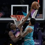 
              Phoenix Suns forward Jalen Smith blocks a shot by Charlotte Hornets forward Miles Bridges during the first half of an NBA basketball game on Sunday, Jan. 2, 2022, in Charlotte, N.C. (AP Photo/Chris Carlson)
            