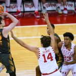 
              Iowa's Patrick McCaffery (22) shoots against Wisconsin's Carter Gilmore (14) during the first half of an NCAA college basketball game Thursday, Jan. 6, 2022, in Madison, Wis. (AP Photo/Andy Manis)
            