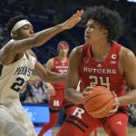 
              Rutgers Ron Harper, Jr. (24) moves the ball on the baseline against Penn State's Jalen Pickett (22) in the first half of an NCAA college basketball game Tuesday, Jan 11, 2022, in State College, Pa. (AP Photo/Gary M. Baranec)
            