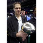 
              FILE - New England Patriots quarterback Tom Brady holds the Super Bowl trophy after the Patriots beat the St. Louis Rams 20-17 in Super Bowl XXXVI at the Louisiana Superdome, Sunday, Feb. 3, 2002, in New Orleans. Despite reports that he is retiring, Brady has told the Tampa Bay Buccaneers he hasn't made up his mind, two people familiar with the details told The Associated Press, Saturday, Jan. 29, 2022.   (AP Photo/Doug Mills)
            