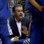 
              Kentucky head coach John Calipari talks to his players during the second half of an NCAA college basketball game against Kansas Saturday, Jan. 29, 2022, in Lawrence, Kan. Kentucky won 80-62. (AP Photo/Charlie Riedel)
            
