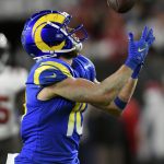 
              Los Angeles Rams wide receiver Cooper Kupp (10) pulls in a pass from quarterback Matthew Stafford during the second half of an NFL divisional round playoff football game against the Tampa Bay Buccaneers Sunday, Jan. 23, 2022, in Tampa, Fla. (AP Photo/Jason Behnken)
            